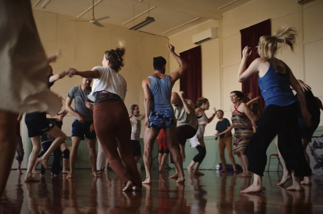 Bare feet dancing on timber floor